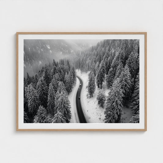 aerial-of-snow-covered-road-slicing-through-dark 48x36-natural frame frame