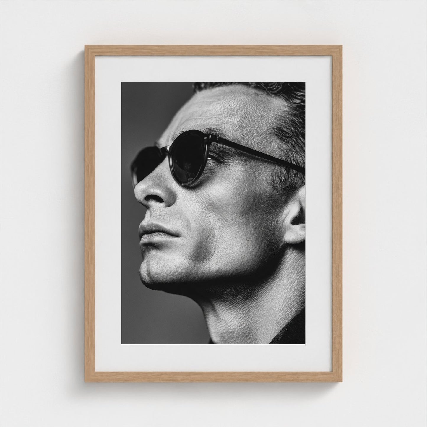 black-and-white-portrait-of-a-cool-guy-in-sungla 18x24-natural frame frame