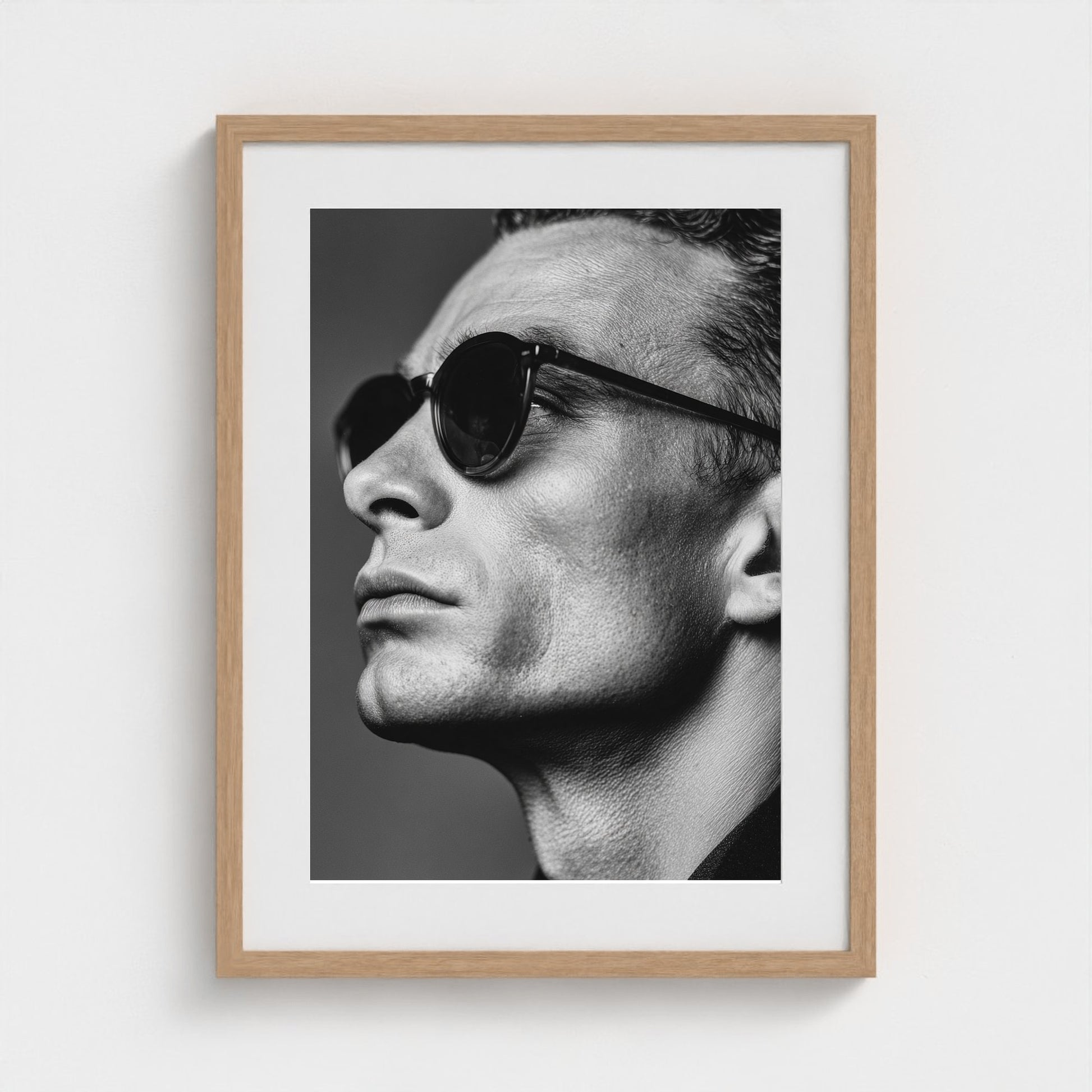 black-and-white-portrait-of-a-cool-guy-in-sungla 18x24-natural frame frame