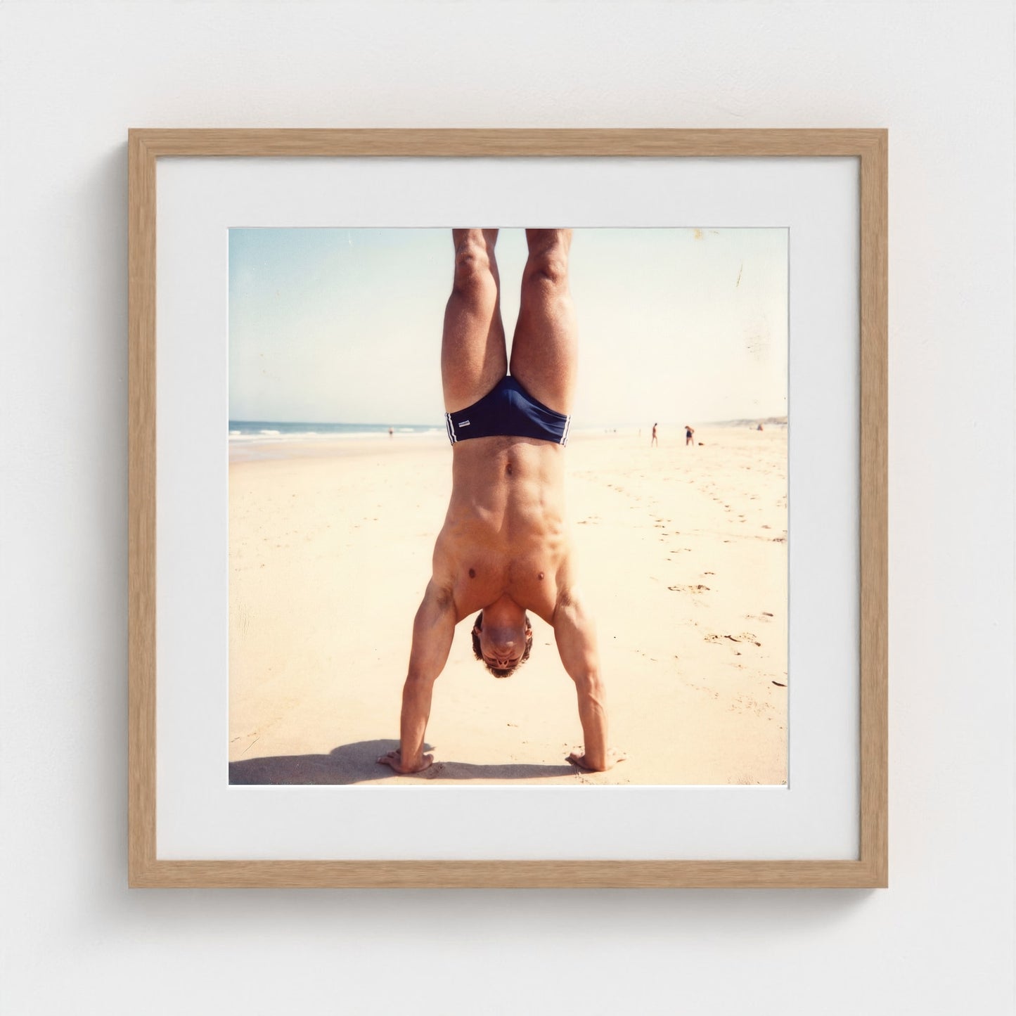 2026 03 12 17 48 00 Handstand Beach Muscular 20x20-natural frame — Fire Island Modern