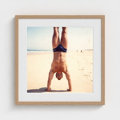 2026 03 12 17 48 00 Handstand Beach Muscular 20x20-natural frame — Fire Island Modern