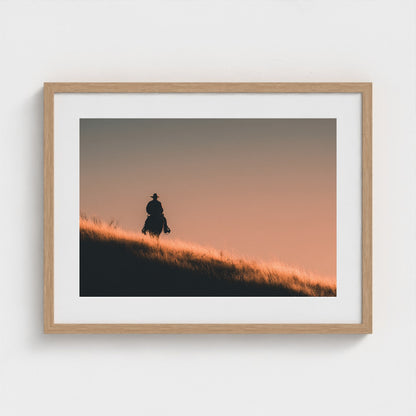 minimalist-cowboy-silhouette-at-sunrise-desert-h 24x18-natural frame frame
