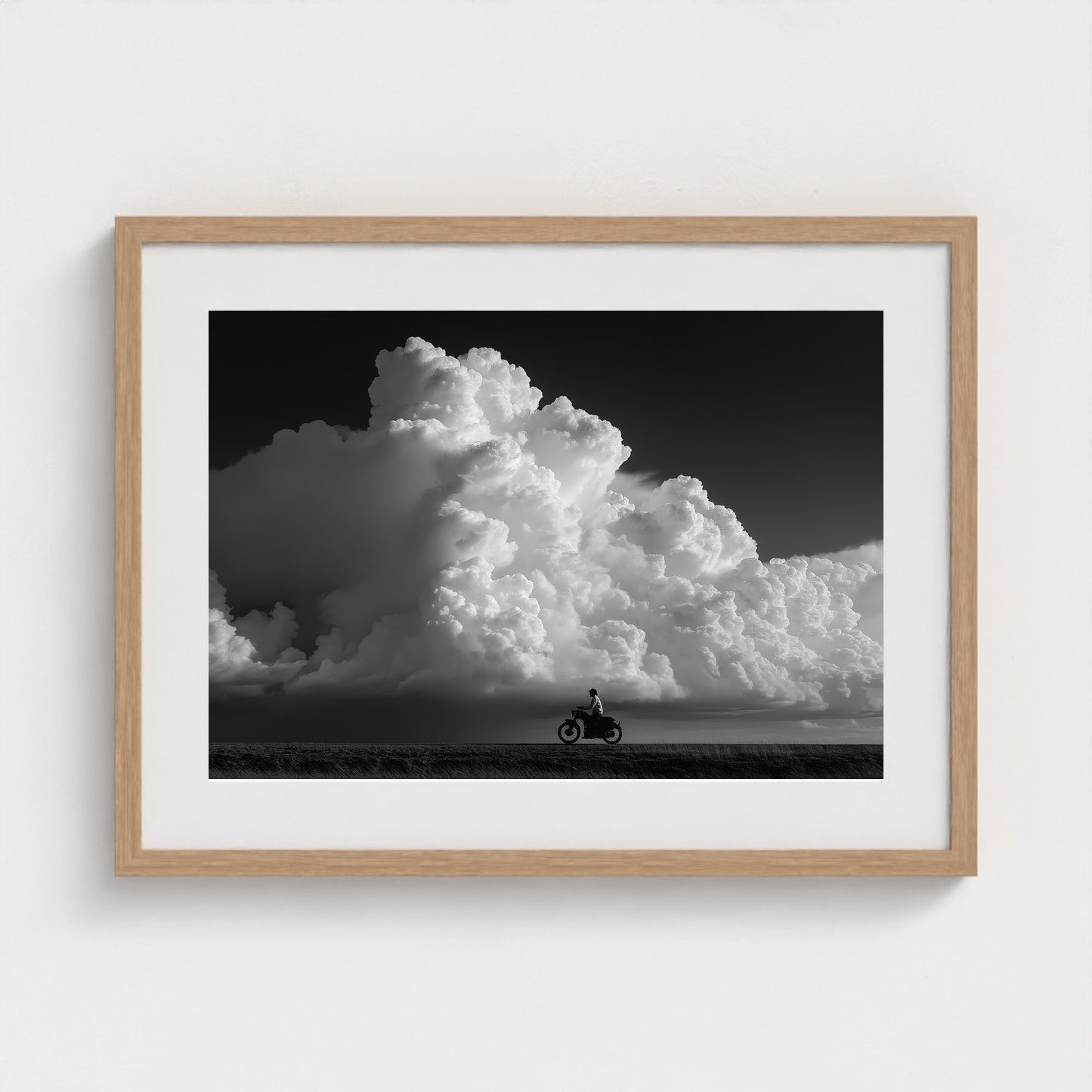 monochrome-thunderhead-build-up-distant-rider-bene-0d9ea2aa- 24x18-natural frame frame