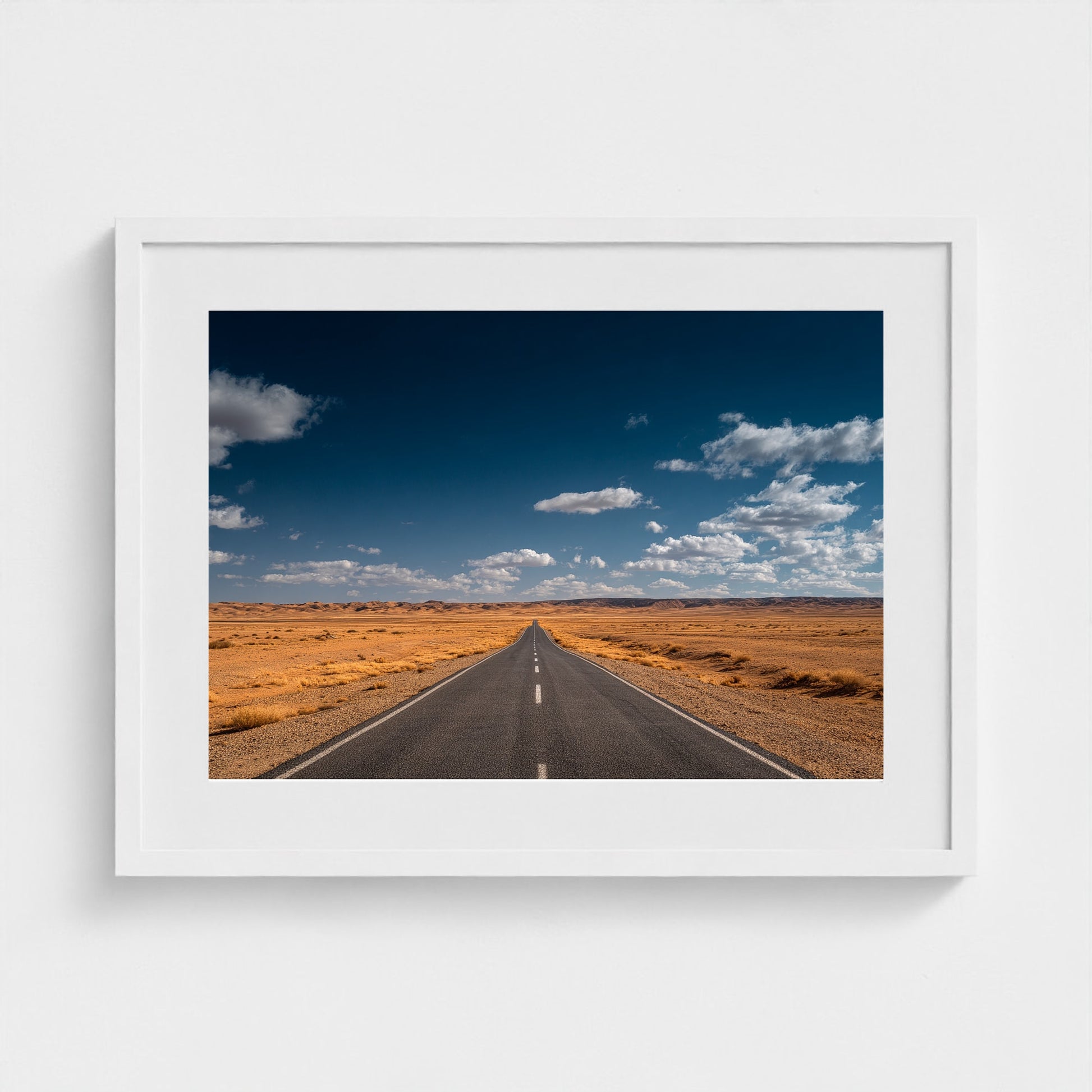 vast-open-desert-with-single-road-disappearing-i 24x18-white frame frame