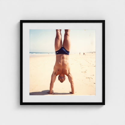 2026 03 12 17 48 00 Handstand Beach Muscular 24x24-black frame — Fire Island Modern