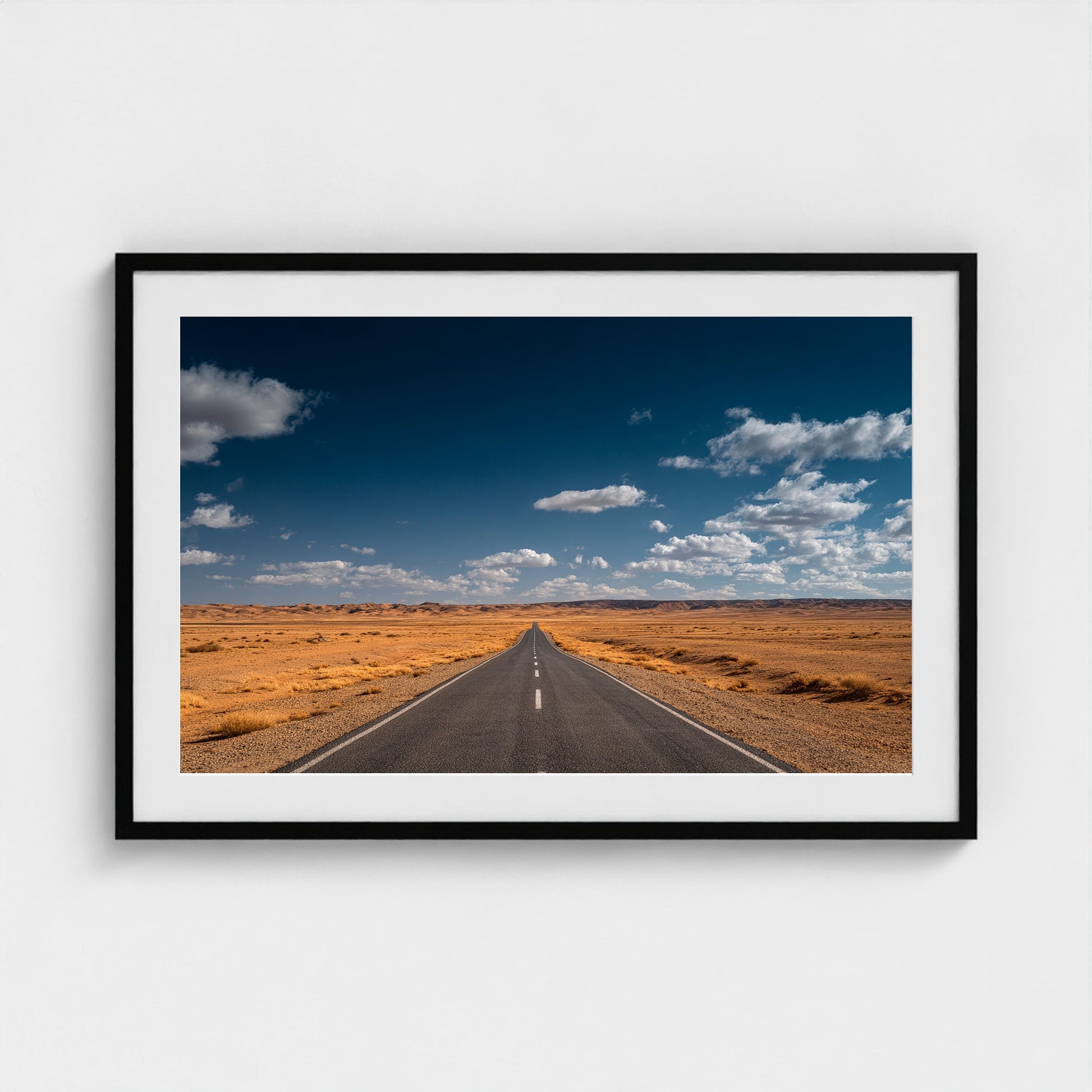 vast-open-desert-with-single-road-disappearing-i 36x24-black frame frame