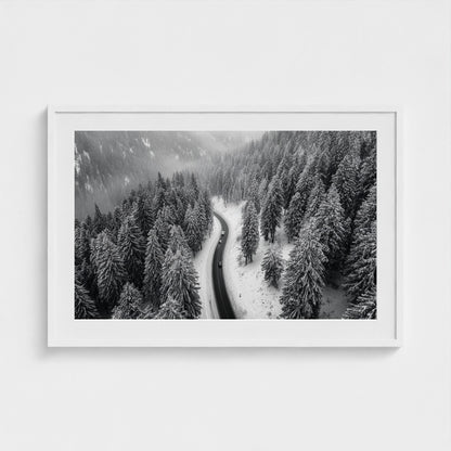 aerial-of-snow-covered-road-slicing-through-dark 36x24-white frame frame