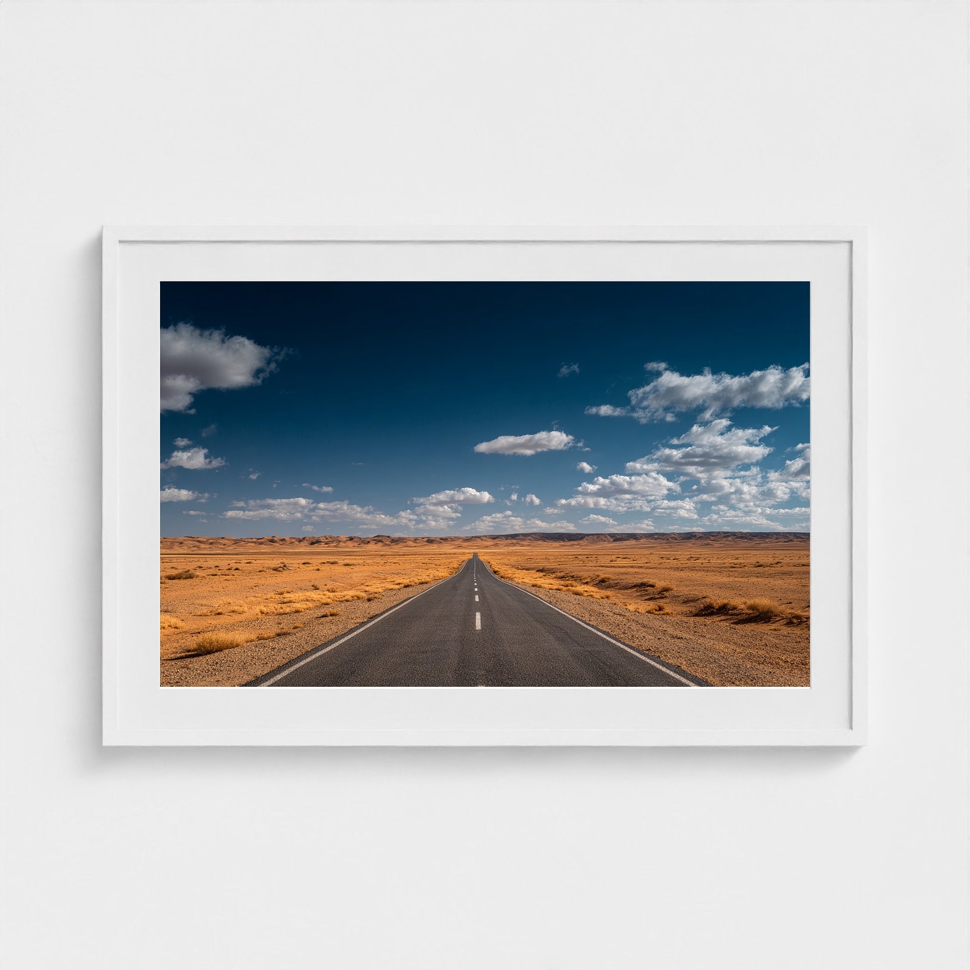 vast-open-desert-with-single-road-disappearing-i 36x24-white frame frame