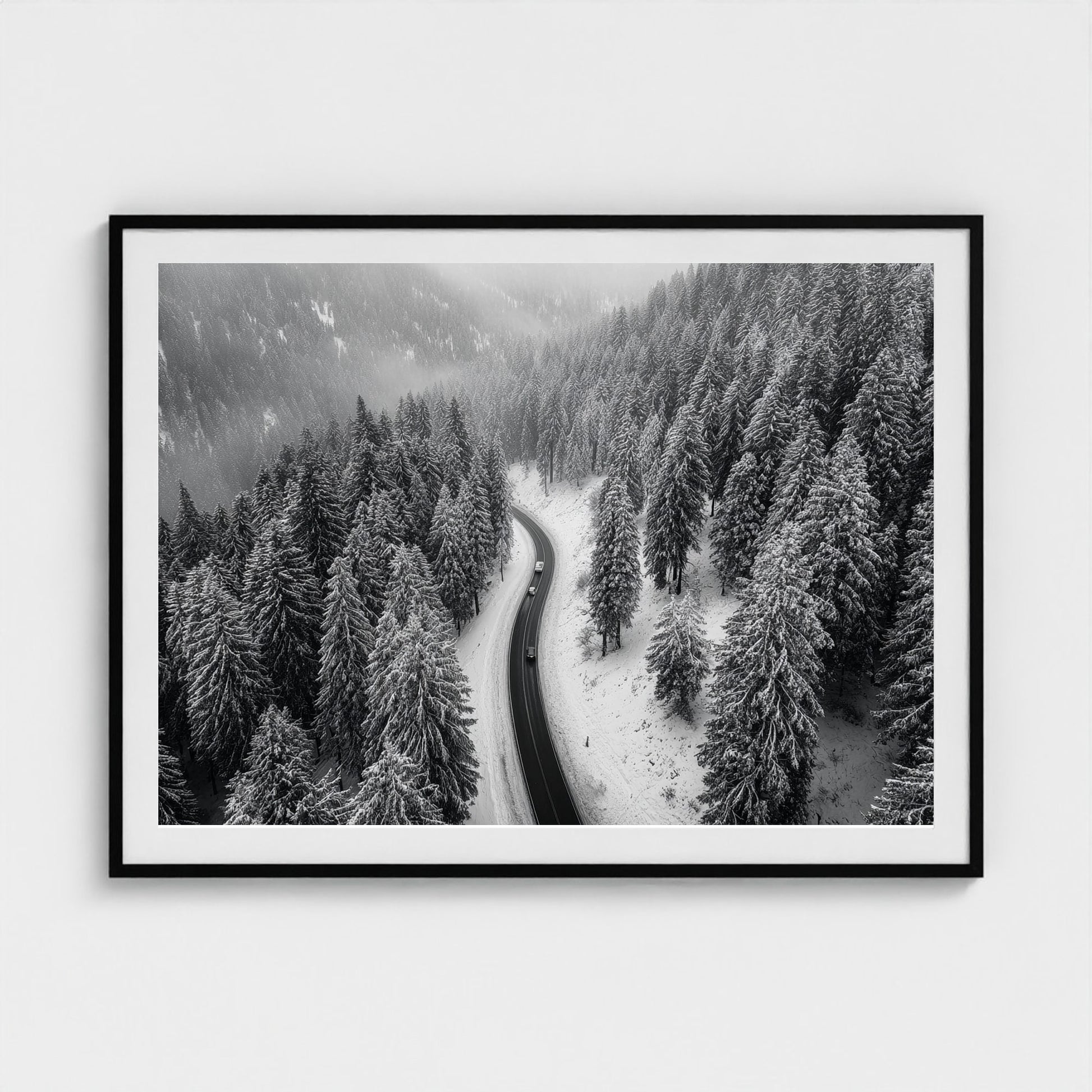 aerial-of-snow-covered-road-slicing-through-dark 48x36-black frame frame
