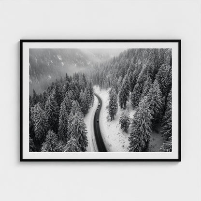 aerial-of-snow-covered-road-slicing-through-dark 48x36-black frame frame