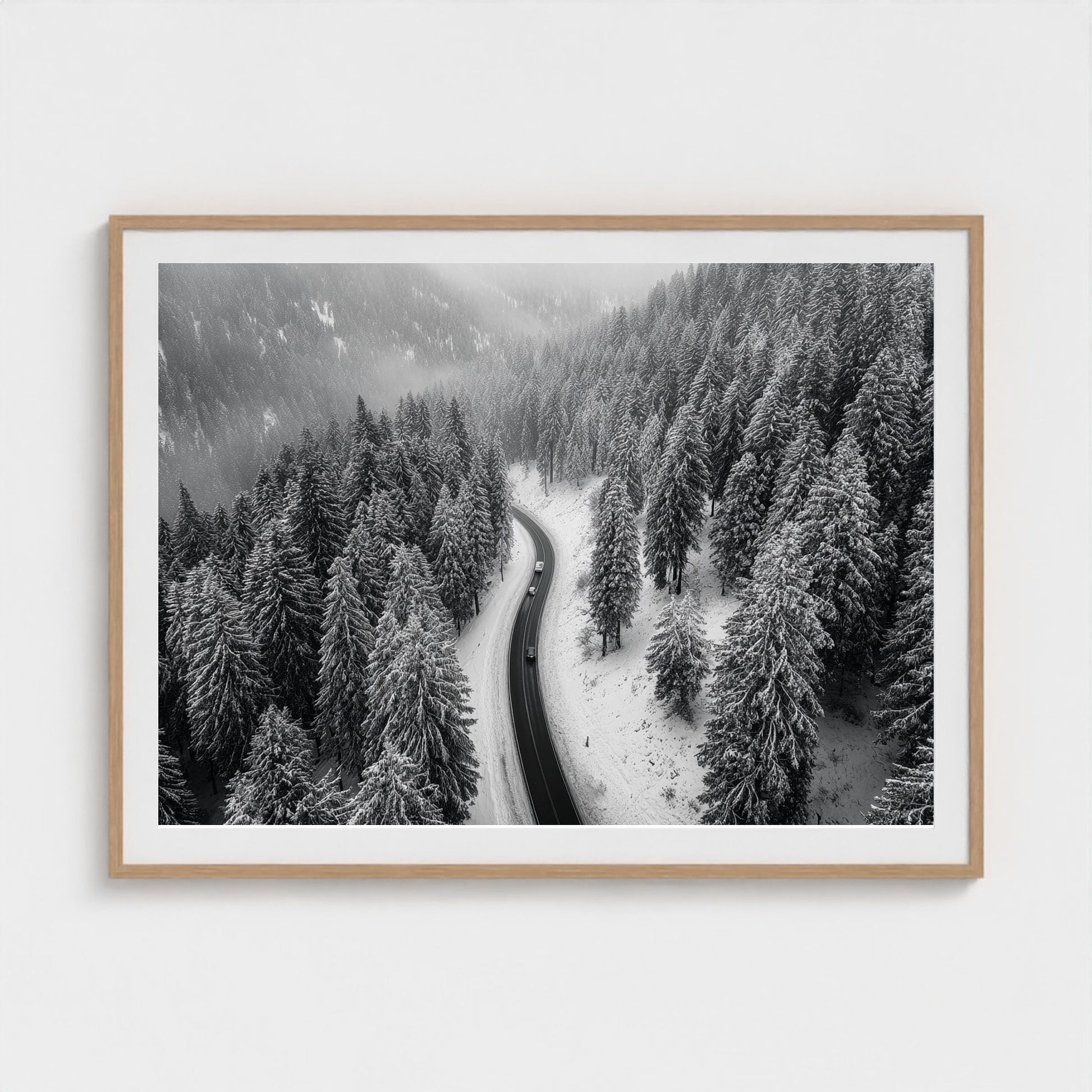 aerial-of-snow-covered-road-slicing-through-dark 48x36-natural frame frame