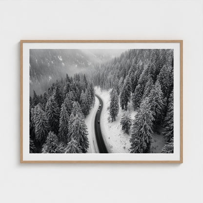 aerial-of-snow-covered-road-slicing-through-dark 48x36-natural frame frame