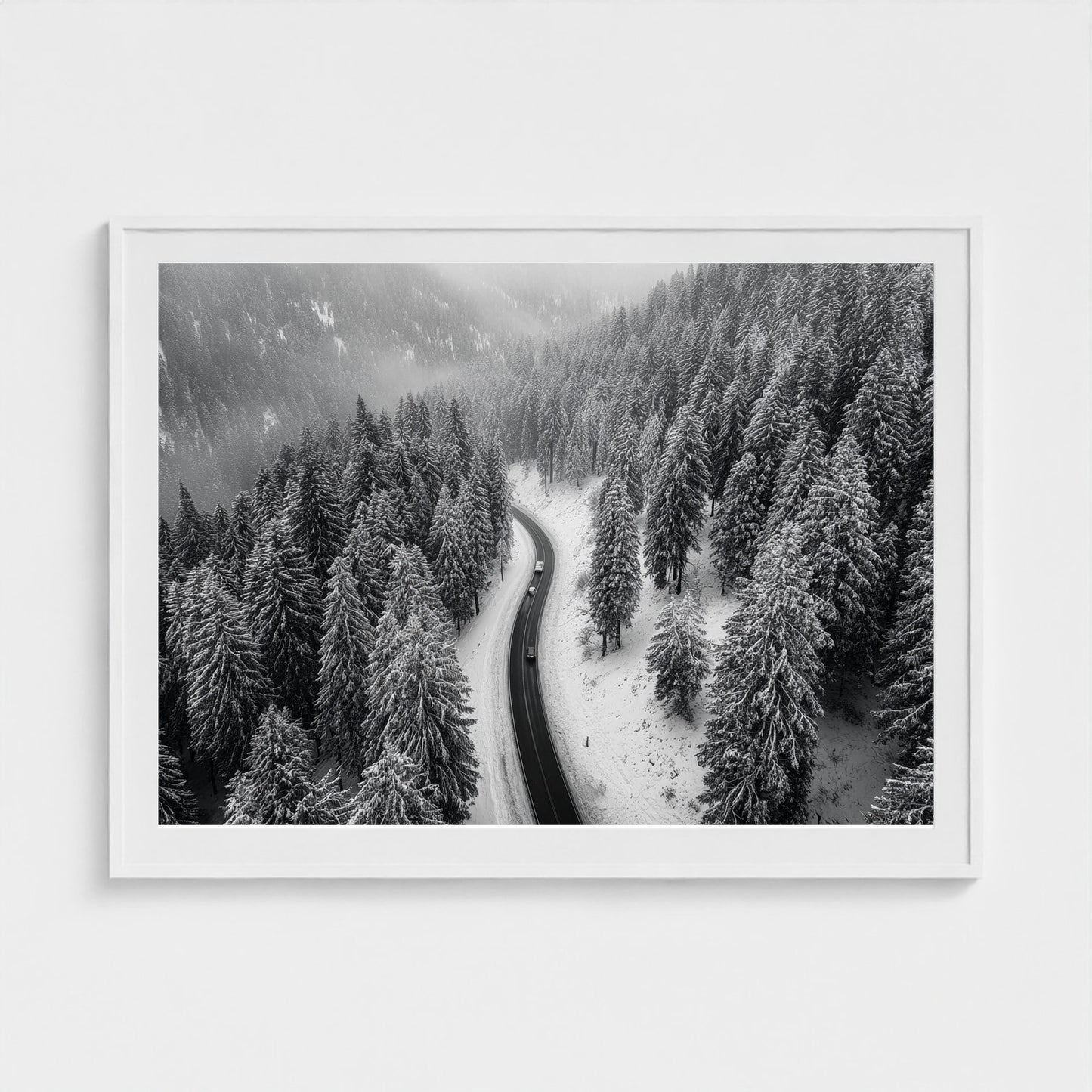 aerial-of-snow-covered-road-slicing-through-dark 48x36-white frame frame