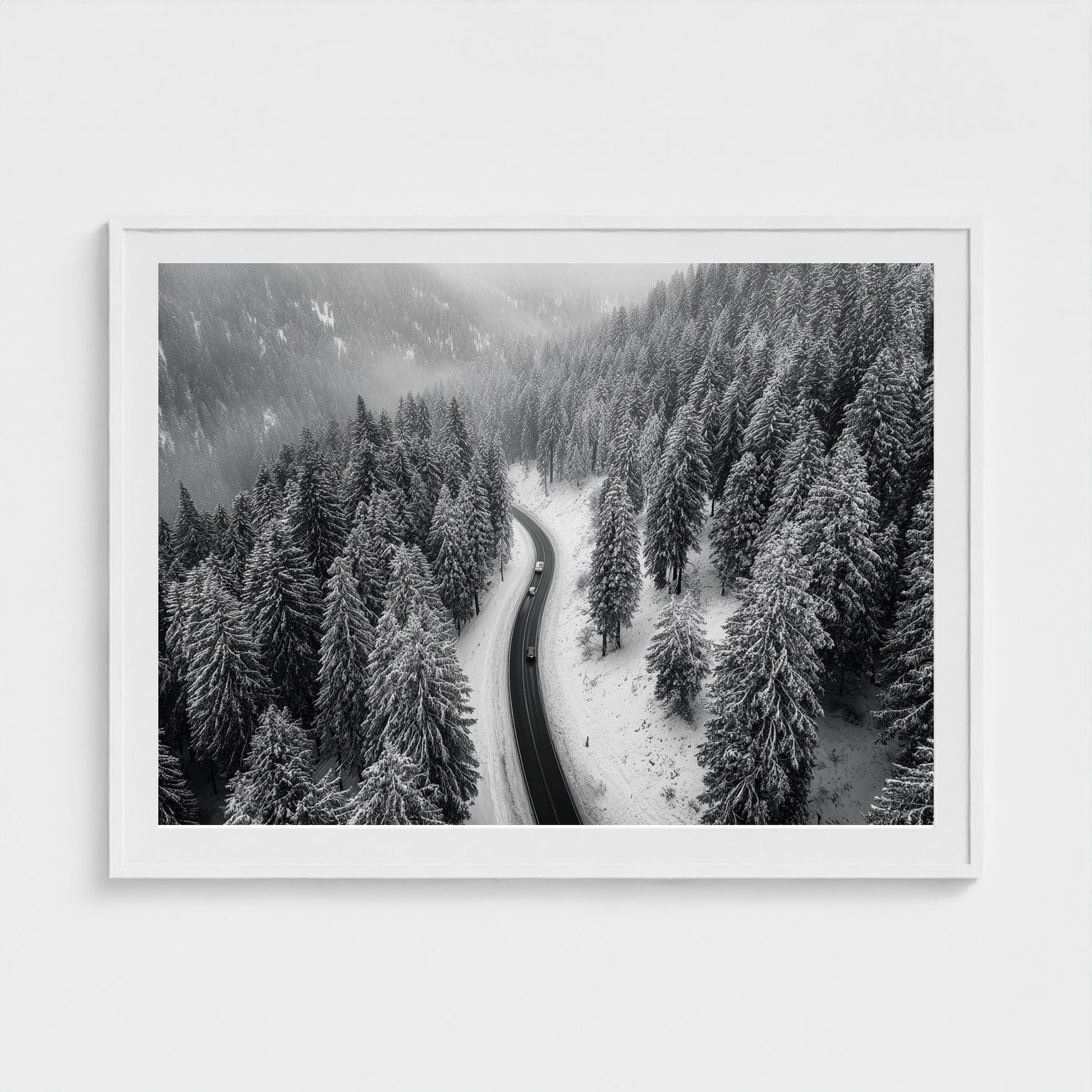 aerial-of-snow-covered-road-slicing-through-dark 48x36-white frame frame