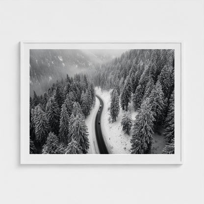 aerial-of-snow-covered-road-slicing-through-dark 48x36-white frame frame